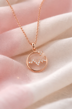 Anti-Tarnish, Ashaarya, Ashaarya Jewels, Ashaarya Jewellery, Rose gold necklace with a circular pendant on a soft pink background
