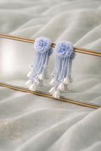 Anti-Tarnish, Ashaarya, Ashaarya Jewels, Ashaarya Jewellery, Light blue floral tassel earrings on a reflective surface