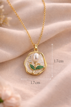 Anti-Tarnish, Ashaarya, Ashaarya Jewels, Ashaarya Jewellery, Gold necklace with a pendant on a soft pink fabric background