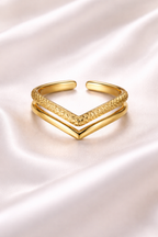 Anti tarnish V shaped chevron adjustable ring in gold finish – comfort jewellery silver rings for girls by Ashaarya Gold bracelet with a chevron design on a white satin background