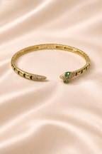anti-tarnish comfort jewellery snake bracelet for women with American diamonds and emerald stones in 18kt gold tone luxury bracelet