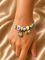 Anti-tarnish Chaand Nazar charm bracelet with moon, star and evil eye charms in gold-tone comfort jewellery design by Ashaarya.