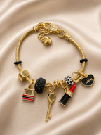 Anti-tarnish gold charm bracelet with lipstick key handbag and heart charms for women