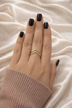 Minimal chevron V shaped ring anti tarnish gold finish – stackable comfort jewellery ring Hand with black nail polish wearing a gold ring on a beige fabric background